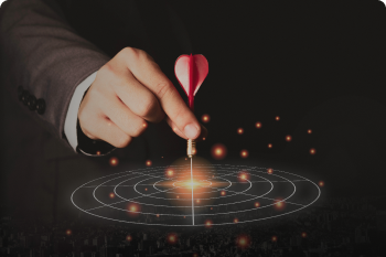 executive-marketing-hand-holding-red-dart-put-centre-target-board-business-investment-goal-target-concept 1.png