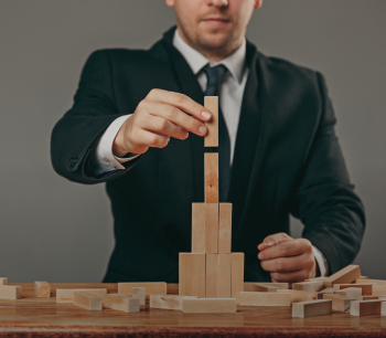 man-wooden-cubes-table-management-concept (1) 1.png